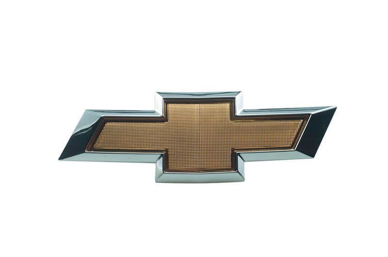 Emblema grade radiador - 52016723 - Celta, Prisma, Prisma A