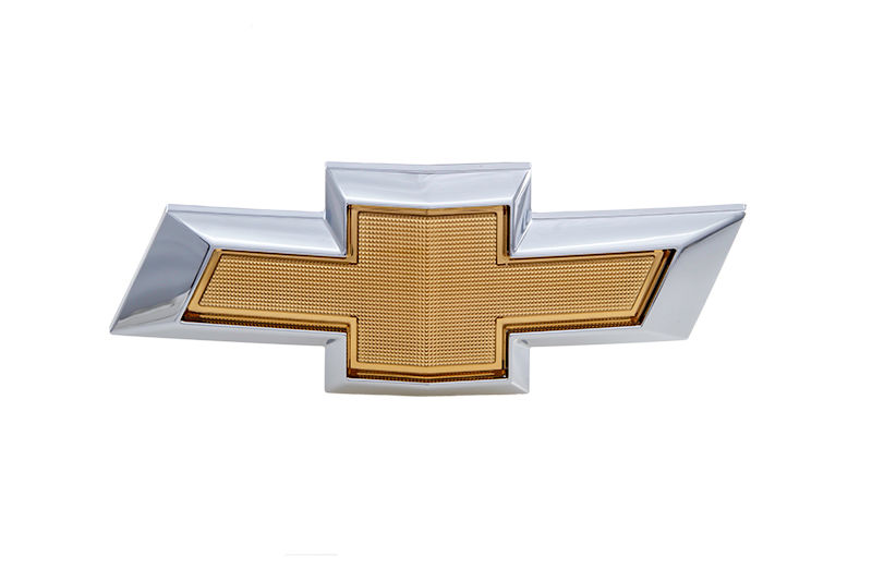 Emblema grade radiador - 94747898 - Onix/Joy Ger.1, Prisma/Joy Plus, Onix A Hatch